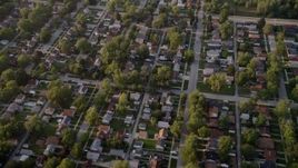 4.8K aerial stock footage reverse view of a Lansing residential neighborhood, revealing Memorial Junior High School, Lansing, Illinois Aerial Stock Footage | AX0001_176