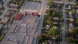 4.8K aerial  video reverse view of Memorial Junior High School, revealing homes in Lansing, Chicago, Illinois Aerial Stock Footage | AX0001_177