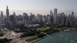 4.8K aerial stock footage approach Grant Park and Downtown Chicago skyscrapers, Illinois Aerial Stock Footage | AX0002_006