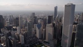 4.8K aerial stock footage tilt from Lake Shore Drive, revealing Cloud Gate, Jay Pritzker Pavilion, and downtown Chicago skyscrapers, Illinois Aerial Stock Footage | AX0002_007