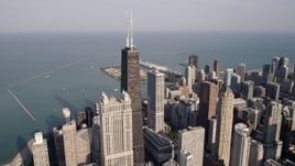 4.8K aerial stock footage orbiting John Hancock Center with Lake Michigan in the background, Downtown Chicago, Illinois Aerial Stock Footage | AX0002_014