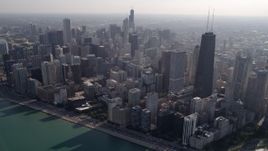 4.8K aerial stock footage tilt from Lake Shore Drive to John Hancock Center and skyscrapers in Downtown Chicago, Illinois Aerial Stock Footage | AX0002_017