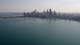 4.8K aerial stock footage tilt from Lake Michigan, revealing Downtown Chicago skyline, Illinois Aerial Stock Footage | AX0002_018