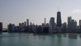 4.8K aerial stock footage of approaching Downtown Chicago skyline from Lake Michigan, Illinois Aerial Stock Footage | AX0002_021
