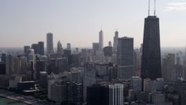 4.8K aerial stock footage approach John Hancock Center and downtown from Lake Michigan, Downtown Chicago, Illinois Aerial Stock Footage | AX0002_023