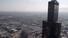 4.8K aerial stock footage of flying by Willis Tower toward West Chicago, on a hazy day, Illinois Aerial Stock Footage | AX0002_031