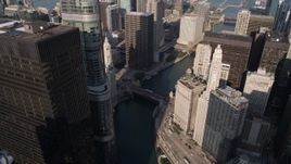 4.8K aerial stock footage of following the Chicago River past 321 North Clark and Marina City in Downtown Chicago, Illinois Aerial Stock Footage | AX0002_040