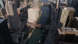 4.8K aerial stock footage of following the Chicago River with bridges in Downtown Chicago, Illinois Aerial Stock Footage | AX0002_041