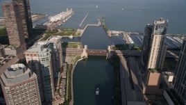 4.8K aerial stock footage follow the river through downtown, tilt and approach Navy Pier and Lake Michigan, Downtown Chicago, Illinois Aerial Stock Footage | AX0002_042