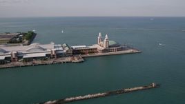 4.8K aerial stock footage of flying by the side of Navy Pier on Lake Michigan, Chicago, Illinois Aerial Stock Footage | AX0002_044