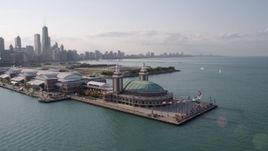 4.8K aerial stock footage of orbiting the end of Navy Pier, revealing the Downtown Chicago skyline, Illinois Aerial Stock Footage | AX0002_045