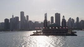 4.8K aerial stock footage tilt from Lake Michigan to reveal and approach Navy Pier and Downtown Chicago, Illinois Aerial Stock Footage | AX0002_049