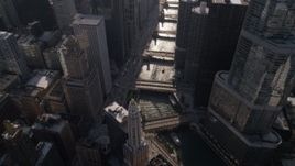 4.8K aerial stock footage of bird's eye view of bridges spanning Chicago River, revealing Tribune Tower and Marina City, Downtown Chicago, Illinois Aerial Stock Footage | AX0002_054