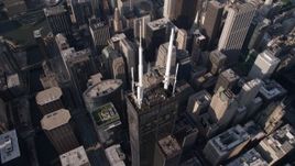 4.8K aerial stock footage tilt to bird's eye view of spires atop Willis Tower, Downtown Chicago, Illinois Aerial Stock Footage | AX0002_068