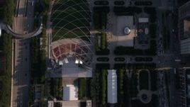 4.8K aerial stock footage of a bird's eye view of the Jay Pritzker Pavilion and the Cloud Gate sculpture in AT&T Plaza, Downtown Chicago, Illinois Aerial Stock Footage | AX0002_080