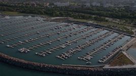 4.8K aerial stock footage approach 31st Street Harbor and fly over boats in the docks, Chicago, Illinois Aerial Stock Footage | AX0002_090
