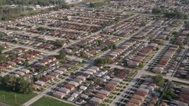 4.8K aerial stock footage of flying over rows of suburban homes in Lansing, Illinois Aerial Stock Footage | AX0002_105