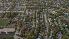 4.8K aerial stock footage of flying over residential neighborhoods at sunset, Calumet City, Illinois Aerial Stock Footage | AX0003_004