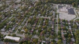 4.8K aerial stock footage of flying over neighborhood in Calumet City at sunset, Chicago, Illinois Aerial Stock Footage | AX0003_005