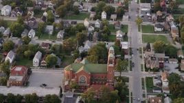 4.8K aerial stock footage of flying over residential neighborhood, tilt to church, at sunset, Calumet City, Illinois Aerial Stock Footage | AX0003_006