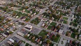 4.8K aerial stock footage of a reverse view of a residential neighborhood in Calumet City, Illinois at sunset Aerial Stock Footage | AX0003_007