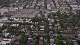 4.8K aerial stock footage of flying over a residential neighborhood in Jackson Park Highlands at twilight, Chicago, Illinois Aerial Stock Footage | AX0003_014