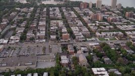 4.8K aerial stock footage of apartment buildings and elementary school in Jackson Park Highlands, at twilight, Chicago, Illinois Aerial Stock Footage | AX0003_015