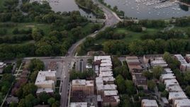 4.8K aerial stock footage fly over apartment buildings, reveal Jackson Park Golf Course and harbor, Jackson Park Highlands, Chicago, Illinois, twilight Aerial Stock Footage | AX0003_016