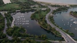 4.8K aerial stock footage of flying over Jackson Park Harbor at twilight, Chicago, Illinois Aerial Stock Footage | AX0003_017