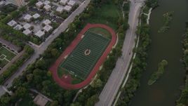 4.8K aerial stock footage of a bird's eye view of a hockey field in Jackson Park at twilight, Chicago, Illinois Aerial Stock Footage | AX0003_018