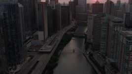 4.8K aerial stock footage of following Chicago River through Downtown Chicago, Illinois, sunset Aerial Stock Footage | AX0003_036