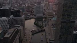 4.8K aerial stock footage follow the river through downtown toward 333 N Canal Street at sunset, Downtown Chicago, Illinois Aerial Stock Footage | AX0003_040