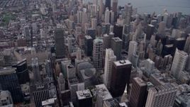 4.8K aerial stock footage tilt from cityscape, approach Trump International Hotel and Tower at sunset, Downtown Chicago, Illinois Aerial Stock Footage | AX0003_047