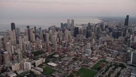 4.8K aerial stock footage of a wide view of the Chicago cityscape by Lake Michigan, Downtown Chicago, Illinois, sunset Aerial Stock Footage | AX0003_056