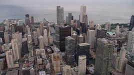 4.8K aerial stock footage approach Trump International Hotel and Tower and skyscrapers on a cloudy day at sunset, Illinois Aerial Stock Footage | AX0003_059