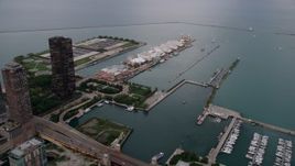 4.8K aerial stock footage of approaching Navy Pier and Lake Michigan from the Chicago River in Downtown Illinois, sunset Aerial Stock Footage | AX0003_061