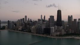 4.8K aerial stock footage of a view of John Hancock Center and Downtown Chicago, Illinois, twilight Aerial Stock Footage | AX0003_071