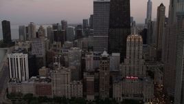 4.8K aerial stock footage flyby John Hancock Center, Drake Hotel and Lakefront buildings in Downtown Chicago, Illinois, sunset Aerial Stock Footage | AX0003_076