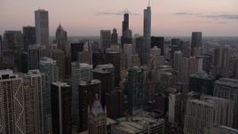 4.8K aerial stock footage of passing by Downtown Chicago skyscrapers at sunset, Illinois Aerial Stock Footage | AX0003_078