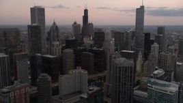 4.8K aerial stock footage flyby skyscrapers and high-rises at sunset in Downtown Chicago, Illinois and reveal the Chicago River Aerial Stock Footage | AX0003_079
