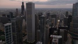 4.8K aerial stock footage of Chicago River and high-rises between Aon Center and Trump Tower at sunset, Downtown Chicago, Illinois Aerial Stock Footage | AX0003_080