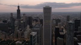 4.8K aerial stock footage flyby Aon Center with a view of Willis Tower, Downtown Chicago, Illinois, sunset Aerial Stock Footage | AX0003_081