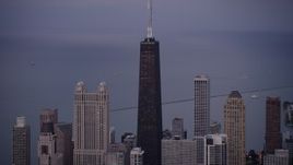 4.8K aerial stock footage of flying by John Hancock Center, Downtown Chicago, Illinois, twilight Aerial Stock Footage | AX0003_091