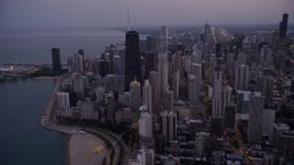 4.8K aerial stock footage of John Hancock Center skyscraper and Downtown Chicago cityscape, Illinois, twilight Aerial Stock Footage | AX0003_094