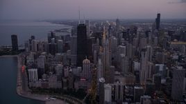 4.8K aerial stock footage approach John Hancock Center and waterfront high-rises at twilight, Downtown Chicago, Illinois Aerial Stock Footage | AX0003_095