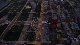 4.8K aerial stock footage of a bird's eye of N Michigan Avenue between Grant Park and Downtown Chicago buildings, Illinois, twilight Aerial Stock Footage | AX0003_101