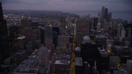 4.8K aerial stock footage of following S Clark Street through Downtown Chicago at twilight, Illinois Aerial Stock Footage | AX0003_104