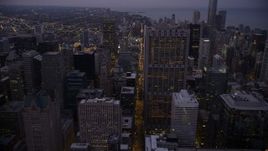 4.8K aerial stock footage of following N Clark Street through Downtown Chicago at twilight, Illinois Aerial Stock Footage | AX0003_105
