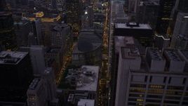 4.8K aerial stock footage follow N Clark Street to approach James R. Thompson Center, Downtown Chicago, Illinois, twilight Aerial Stock Footage | AX0003_106