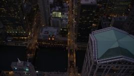 4.8K aerial stock footage bird's eye following N Clark Street over the Chicago River, through downtown, at twilight, Illinois Aerial Stock Footage | AX0003_108